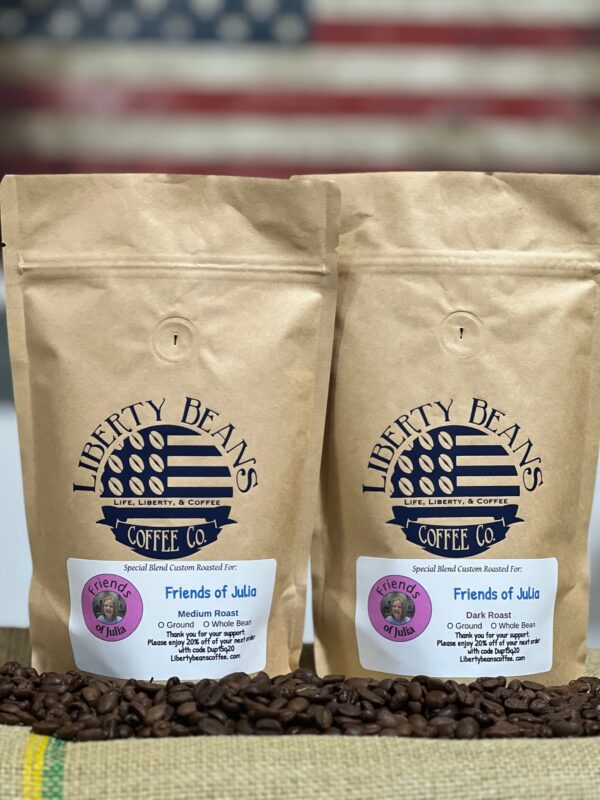 Liberty Beans coffee bags with American flag backdrop.