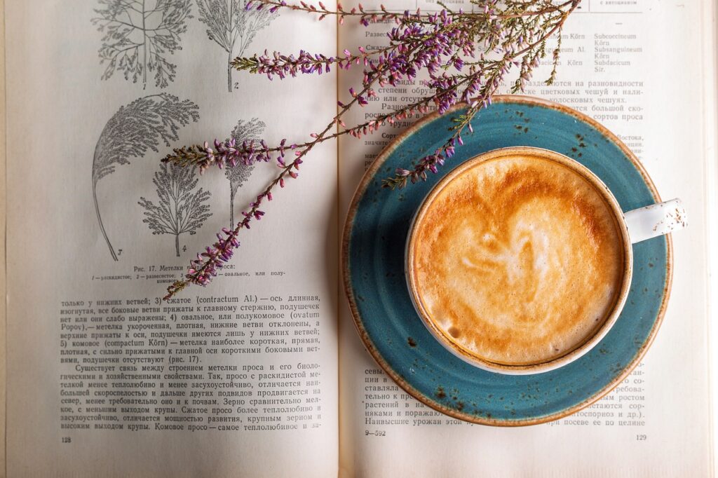 a cup of coffee on a book