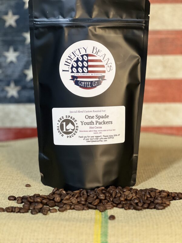 Liberty Beans coffee bag on American flag background.