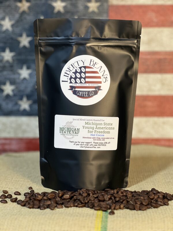 Liberty Beans coffee bag with American flag background.