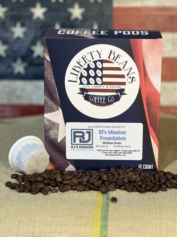 Packaged coffee pods with beans against American flag background.