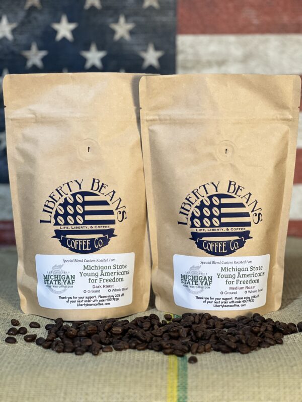 Two bags of specialty coffee with American flag background.