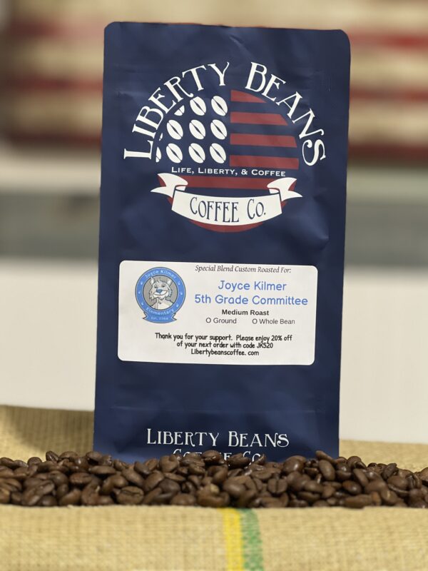 Liberty Beans Coffee bag on burlap with coffee beans.