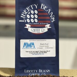 Liberty Beans Coffee bag with scattered coffee beans.