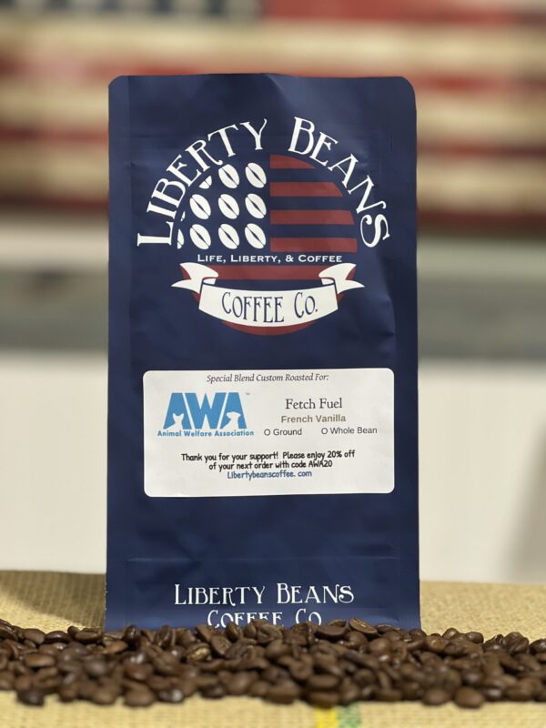 Liberty Beans Coffee bag with scattered coffee beans.