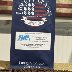 Liberty Beans coffee bag with roasted coffee beans.