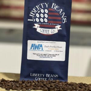 Liberty Beans Coffee Co. bag among coffee beans.