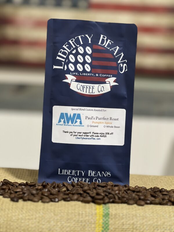 Liberty Beans Coffee Co. bag among coffee beans.