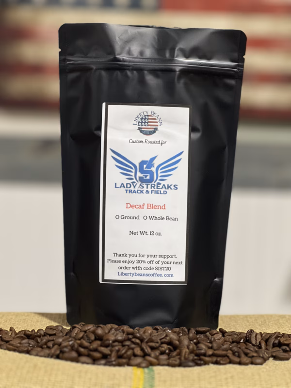 Liberty Beans coffee bag on burlap with beans.