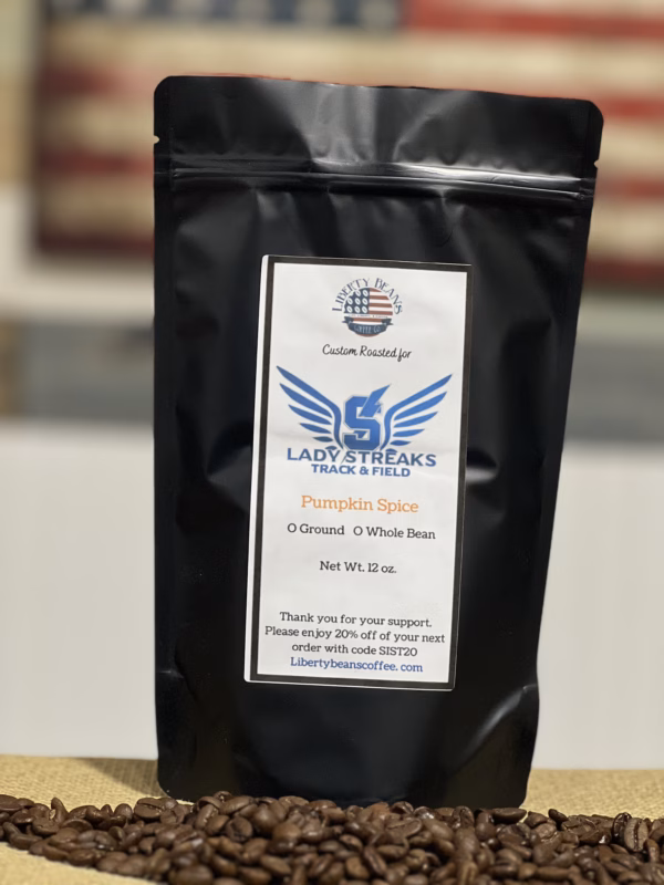 Pumpkin spice coffee bag on roasted beans.